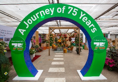 PanAmerican Seed's entrance at FlowerTrials 2022 is full of potted plants and hanging baskets