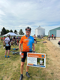 Bike rider celebrating outdoors