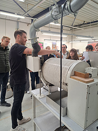 Demonstration in front of a group of people on a facility tour