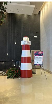 A lighthouse prop that is striped red and white