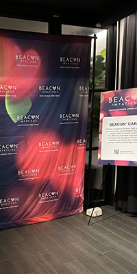 A backdrop features hearts and flowers
