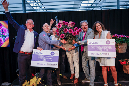 People celebrate their award win on stage