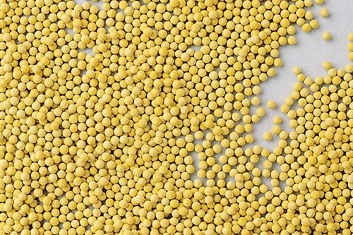 Yellow pelleted seeds