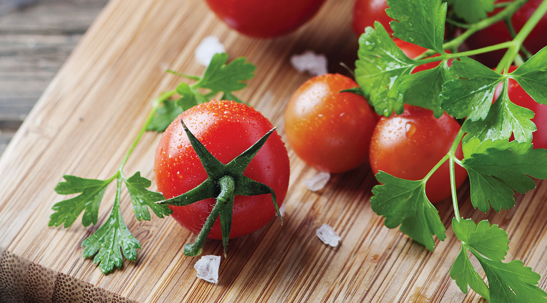 Slide of tomatoes on cutting board